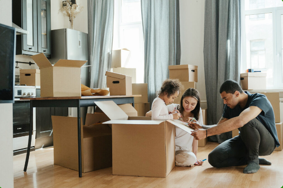 Family unpacking boxes image